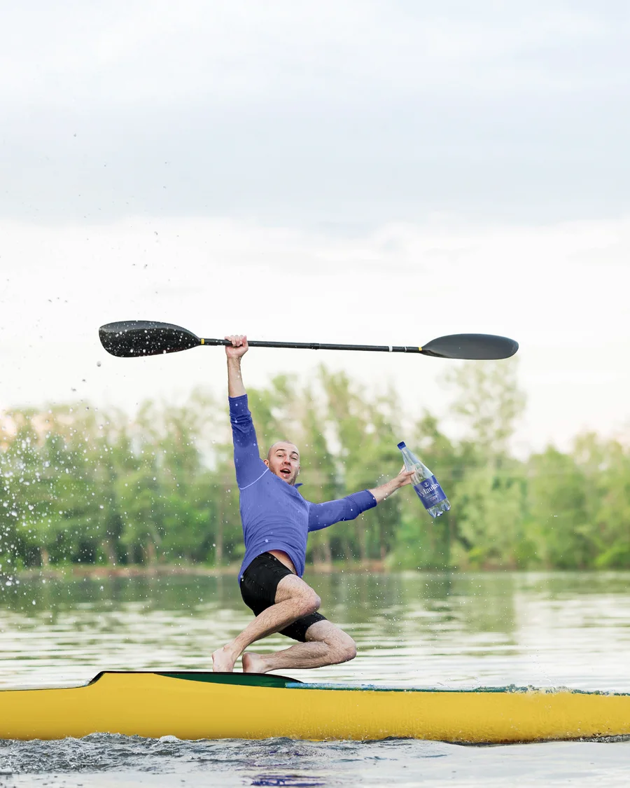 A kayaker on still water in the supplied Vytautas outdoor campaign