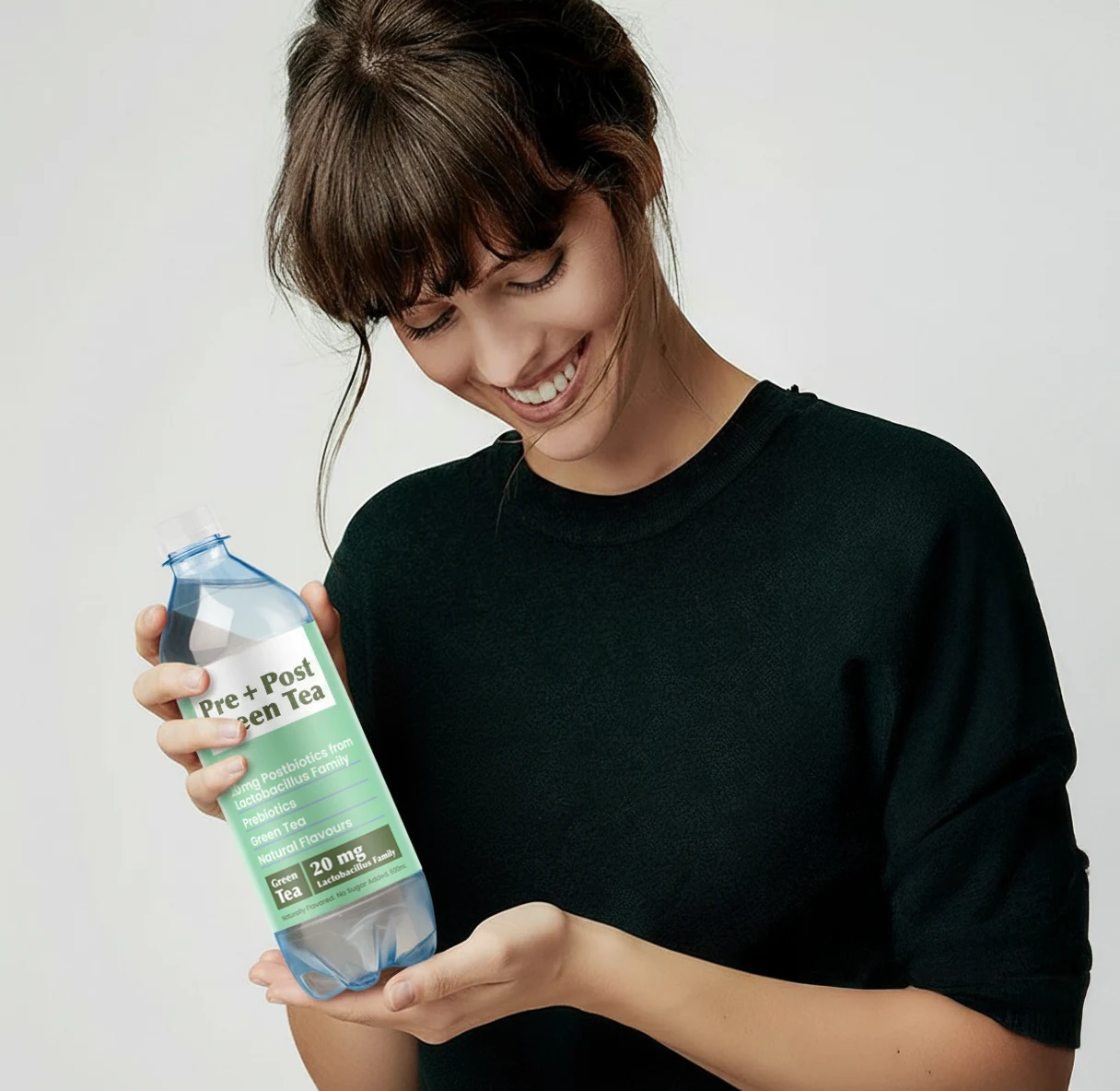 A woman enjoying the green tea drink during a quiet break